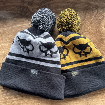 puff ball beanies in gray & yellow with our skull logos