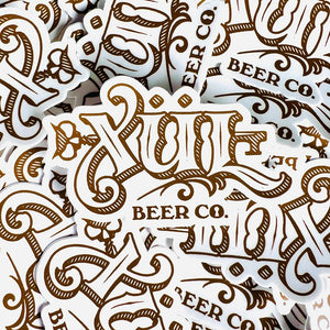 stack of classic logo stickers in white and gold