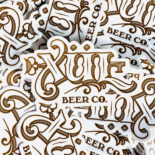 stack of classic logo stickers in white and gold